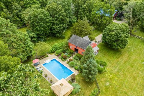 CONVERTED BARNS WITH POOL. This charming getaway offers fun lofty spaces to gather, entertain and enjoy the countryside, while conveniently located to the TSP and Millbrook Village. This 19th century converted barn was beautifully preserved and showc...