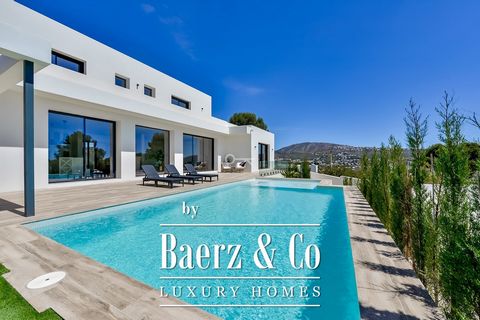 Beautiful contemporary villa in Teulada/Moraira. Situated on an elevated South facing plot of over 800m2, this property enjoys lovely sea views. The villa features a spacious living room, an open modern kitchen with central island fitted with high-en...