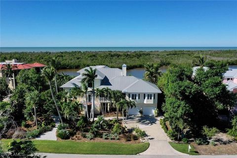 An enchanting location, focusing on the sparkling waters of the Gulf of Mexico and the bountiful wildlife of Clam Bayou. This substantial home rests on over a half acre with beautiful plantings, an elevated pool with spa, and new screen enclosure sho...