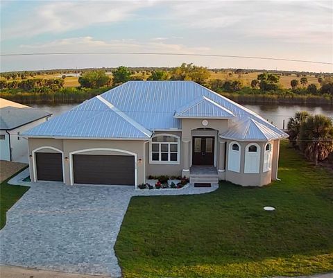 Under contract-accepting backup offers. Builder has coordinated with professional dock company to ensure you can have a custom designed dock and boat lift built within 90 days of closing on this one-of-a-kind home. Plus, he is giving you $20,000 towa...