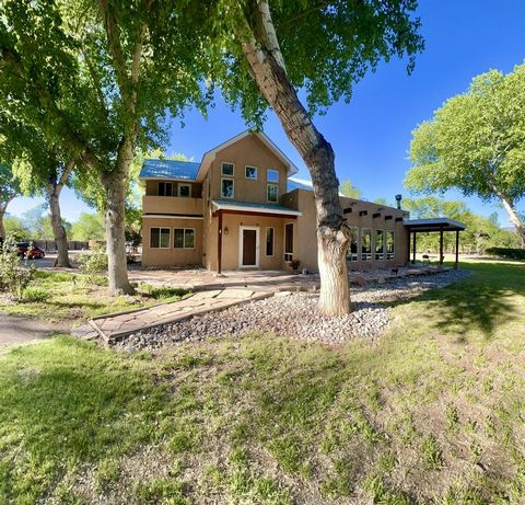 Classic Elegance * Currently under contingent contract* gorgeous Corrales location, amidst the Cottonwood tree-lined ''green belt''. Welcome in! Spacious lofty beamed ceilings begin at the front foyer. The main floor hosts a luxuriously sizable great...