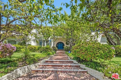Enter this prestigious home nestled in the flats of Beverly Hills-experience luxury living and enjoy the quintessential California lifestyle. Gracing one of the best streets and blocks in prime Beverly Hills, this stately Spanish Colonial home epitom...