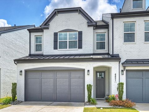 You will LOVE this luxury white brick end-unit townhome with 2-car garage! It is nestled at the rear of the complex, not backing up to other townhomes, with tons of light, greenery, and privacy! The open floorplan is adorned with 10 ft. ceilings and ...