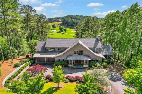 Located on a private cul-de-sac, this modern mountain/lake craftsman home was designed by acclaimed architect Jim Samsel and professionally decorated by interior designer Susan Nilsson. The property is meticulously landscaped with hearty, lush Zoysia...