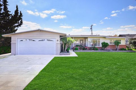 Priced to sell quickly and below market, we present this enchanting 3-bedroom, 2-bath escape tucked away on a quiet cul-de-sac in Garden Grove. Imagine evenings spent unwinding by a crackling fireplace on gleaming, restored hardwood floors. Fresh pai...