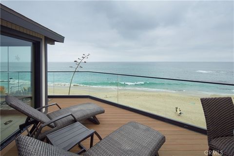 Unobstructed oceanfront views are just one of the countless rewards you will enjoy at this extra-light, exceptionally open Mid-Century Modern home in south Laguna Beach. Featuring private stairs to the sands of Aliso Beach below, the clifftop residen...