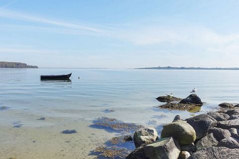 This terraced house at Løjt Holiday Center is decorated with a very personal and cozy style, where cosiness and good furniture make you feel good about fashion in all rooms. From one terrace there is a view to the sea at Genner Bay, so you have the o...