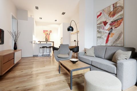 The one bedroom apartment feels very spacious with an efficient floor plan. From the living room you enter onto the terrace. The apartment includes a bespoke modern kitchen equipped with high end Bulthaup appliances. The contemporary kitchen scheme h...