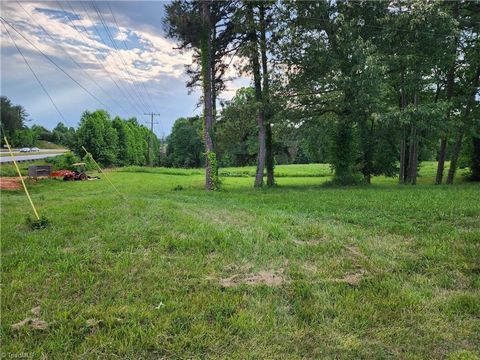 PRICE REDUCTION! Beautiful property with road frontage on Hwy 421 West and N. Holiness Ch Rd. This is a very highly traveled 4-laned highway. Only 25 minutes to Boone, 45 minutes to Winston Salem, 45 minutes to Statesville, 35 minutes to West Jeffers...