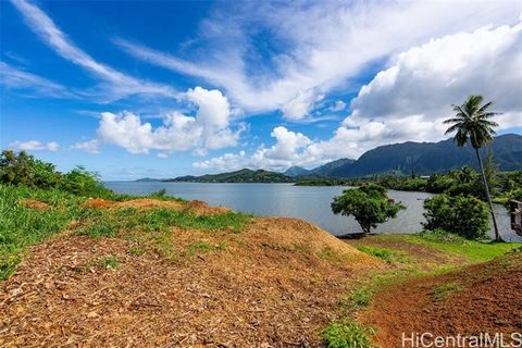 OCEAN FRONT VACANT LAND! 102 Linear feet of water frontage. One of two adjacent 6000+ square foot vacant lots along Kaneohe Bay's majestic coastline. Build a dream home with an amazing Sunrise, Ocean and green Mountain views from every room. Direct w...