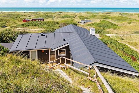Holiday home with whirlpool located on top of a large, hilly dune plot with beautiful panoramic sea views at Grønhøj in an extremely attractive area, which invites to walks in the dunes with a myriad of beach paths and beach activity by the North Sea...