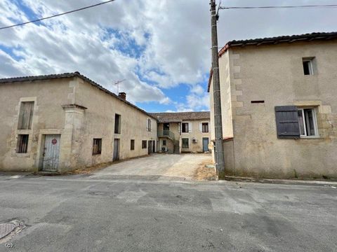 Investment property in the centre of Sauzé-Vaussais with commercial premises (currently rented), three flats, a cottage and outbuildings. There is a communal courtyard and parking for one car for each property. Ideally located, close to all amenities...