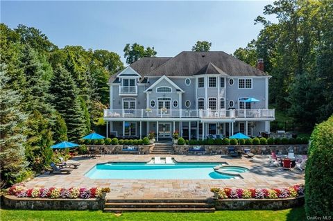 Candlewood Lake direct waterfront oasis complete with west exposure lake views, private boat dock, heated 20X40 in-ground gunite swimming pool with spa and outdoor cooking. The epitome of sophisticated elegance and casual lakefront living at its best...