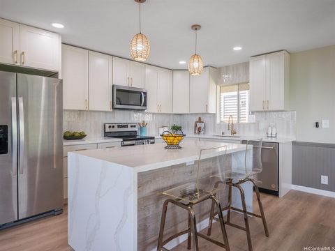 Nestled in the serene community of Ka Momi Nani Heights, this beautifully renovated 4 bedroom, 3.5 bath home offers a perfect blend of comfort and style. The spacious layout features a 3 bedroom, 2.5 bath configuration on the upper level, complete wi...