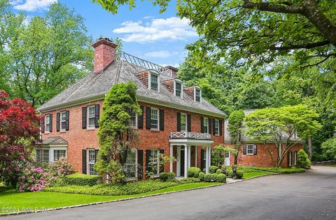 Exquisite architectural details define this classic brick Colonial poised on 2.12 private acres with terraces and pool in a convenient close to town location. Elegant, sunny interior boasts five fireplaces, large windows, four levels and great main f...