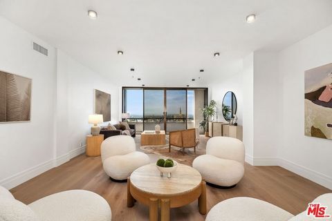 FULLY REMODELED CONTEMPORARY STUNNER!... with views of DTLA, city and ocean in the prestigious Wilshire Manning. Upon entry you are greeted to an expansive open floorplan conveniently accompanied by a spacious living room, dining area, family room/de...