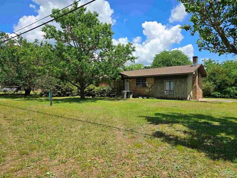 ATTENTION INVESTORS!! This brick home has 3 bedrooms and 1 bathroom and sits on almost an acre of land in the Cantonment area. Roof was replaced April 2024. The carport was turned into a fourth bedroom for the sellers. Home has lots of potential. Nee...