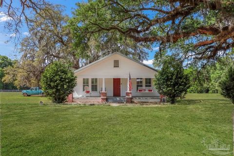 Charming Historic Farmhouse in Milton- Step into a piece of history with this enchanting 3-bedroom, 2-bathroom farmhouse nestled on a lush, nearly 2-acre lot in the heart of Milton. This home offers a perfect blend of privacy and accessibility, surro...