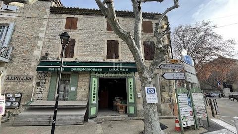 LOCATION N'1: Old mixed-use stone building with commercial premises and storerooms, garage and parking space and upstairs an independent duplex apartment of 83 M2 to be renovated. Superb potential and investment with 180 M2 in total! You plan to crea...