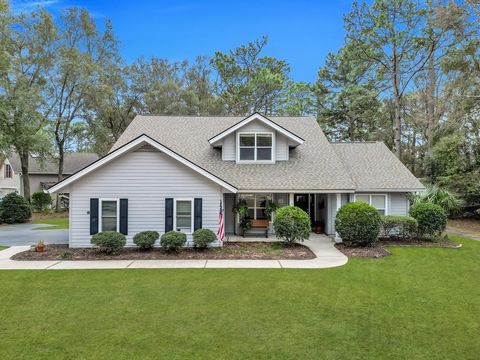 Escape to your own slice of paradise nestled on nearly 3/4 of an acre, where tranquility meets convenience just a golf cart ride away from the charming allure of Old Town Bluffton. This meticulously maintained home welcomes you with a plethora of rec...