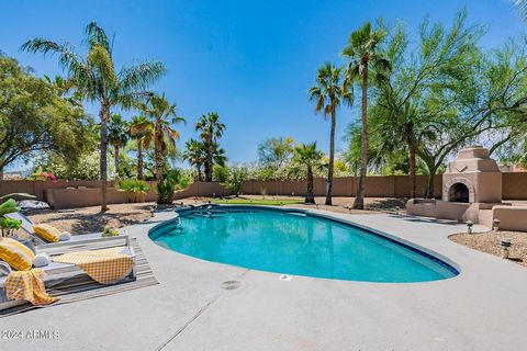 Immerse yourself in desert tranquility at this sprawling Cactus corridor estate on ¾ acre. Enjoy the resort style backyard complete w/newly resurfaced heated pool w/ multi colored LED lights,spa, putting green,covered patio, outdoor kitchen & firepla...