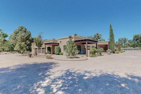 Welcome to this spectacular Territorial Style Hacienda, nestled on 3.4 acres of pristine land in a private gated community. With 6000 square feet of living space, this home is the epitome of luxury living. As you approach the entrance, you are greete...