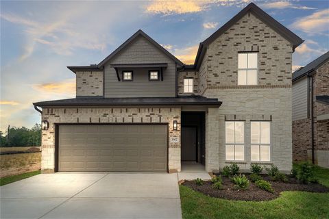 LONG LAKE NEW CONSTRUCTION - Welcome home to 190 Scarlet Yaupon Way located in the community of Barton Creek Ranch and zoned to Conroe ISD. This floor plan features 4 bedrooms, 3 full baths, 1 half bath, Brick and Stone Elevation, Covered Patio, Stud...