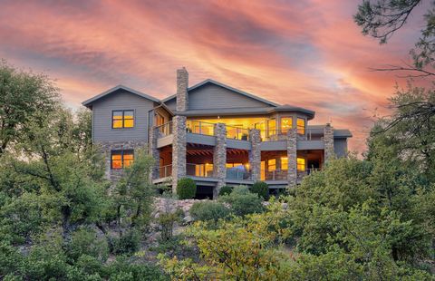 Breathtaking VIEWS! Welcome to this beautiful Chaparral Pines golf retreat. It boasts a spacious layout, with the primary living areas conveniently located on the main level, with amazing views of the Granite Dells, from the large deck. Quality built...