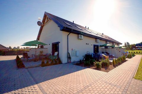 On the edge of a charming seaside settlement, there is a family holiday resort, which offers accommodation in two-story terraced houses and plenty of green space for children to play various games and have fun. Two-story holiday homes with terraces a...