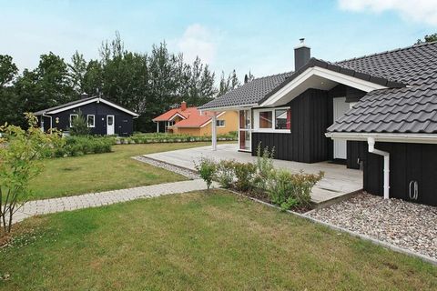This luxurious wooden cottage in Danish building style from 2011 is located in OstseeStrandpark Grömitz. The modern decor with panoramic windows, light wooden walls and sloping walls helps to make the houses look bright and inviting. On cool evenings...