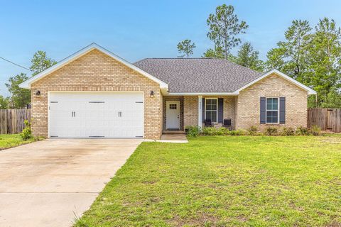 The Pines, on the east side of Crestview is a great location for homeowners that want the best of both worlds! This home sits on .49 of an acre and is still partially wooded for privacy. It features a nice open living area, along with a split floor p...