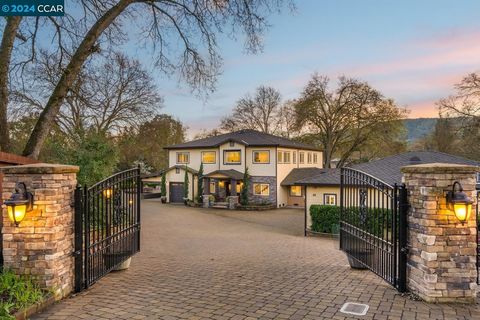 Welcome to this spectacular custom estate nestled behind a private gated entrance and surrounded by brick pavers that extends throughout the entire property. This residence greets you with 6,410 sqft of sophisticated living space, enhanced by an addl...