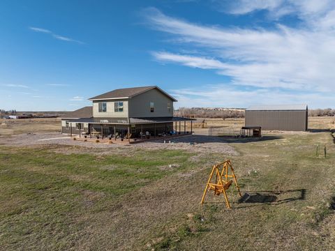 This property is the idyllic countryside retreat, blending modern comforts with rustic charm. The expansive acreage, complete with access to the Popo Agie River and Wyoming State Land, offers a sense of tranquility and adventure. The large wrap-aroun...