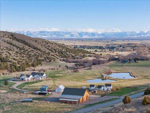 This exceptional Dry Creek ranch retreat nestled in the northern edge of the Gallatin Valley offers privacy, sweeping mountain views, live water, a truly beautiful custom home, gardens, guest house and an immaculate barn and outbuildings where no det...