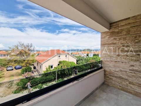 An apartment on the first floor with a sea view is for sale in Murter. It is located in a building with a total of four residential units.  The apartment consists of an open-concept kitchen, dining room and living room, two bedrooms, bathroom, hallwa...