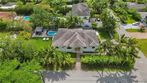 BEAUTIFUL FAMILY HOME IN SOUTH MIAMI! AN ENTERTAINER'S DREAM featuring 5 Bedrooms, 4 Bath, 11,271 Sq Ft Corner Lot with a pool. Open floor concept with plenty of natural light, high ceilings, gourmet kitchen, a chefs dream, with a center island. Spac...
