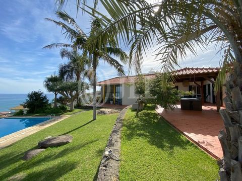 Detached 5+1 bedroom villa with a gross construction area of 227 sqm, set on a plot of land with 1277 sqm, with sea views, in Porto da Cruz, Machico, Madeira. Located at an altitude of 58 meters, it comprises a spacious living room with a fireplace a...