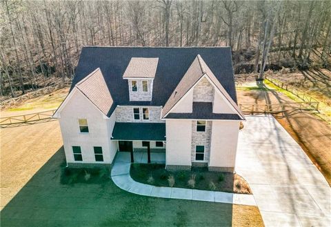 Beautiful new construction home on a one-acre fenced lot. As you enter the home through the covered front porch you will be greeted with an oversized separate formal living room and dining room, full bathroom, and bedroom for guests or aging family. ...