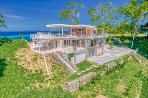 Discover this stunning villa in Roatan, offering unparalleled views of both sides of the island. This beautiful home features one spacious bedroom, two well-appointed bathrooms, an indoor gym, and a modern kitchen. The expansive deck area is perfect ...