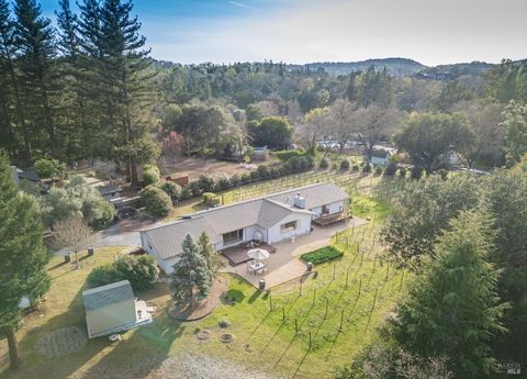 Private Oasis with Half-Acre Vineyard & Stunning Views of Mount George . . .Set on a 1.2+/-acre lot, this private property offers the perfect blend of tranquility and country living, just minutes from downtown Napa. Accessible via a private lane with...