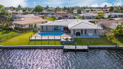 Tastefully renovated Waterfront Home on a canal in Pompano Beach with expansive Water Views, 110 feet of Water-Frontage, Pool, Dock, Sun Deck, 2-Car Garage, New Floors, New Roof (2020), updated Electrical, and Plumbing. Featuring 3 Bedrooms, 3 Bathro...