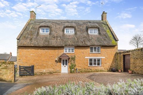 Hill Top Cottage is a charming Grade II Listed detached stone built and thatched property arranged over three floors and combining both traditional and contemporary features with deceptively spacious living space. There is also the added advantage an...