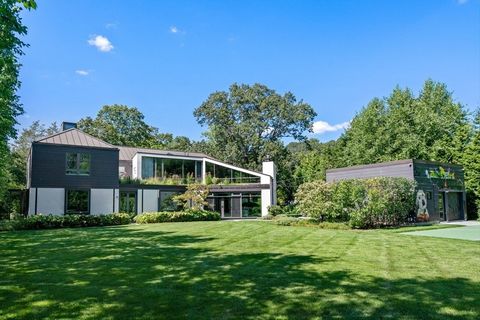 Stunning 7800 sq ft custom contemporary on one of Wellesley's favorite streets in Wellesley Hills. This 5 bedroom 6 bath home sits on .66 acres of level yard w/ an accessory dwelling/party barn. All design & construction decisions are of highest qual...