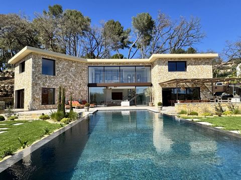 Located in Opio, two minutes from Valbonne, very beautiful new contemporary villa with 5 en-suite bedrooms, wine cellar, double garage, pantry. Living area of approximately 300 m2 (+ 40 m2 garage) all upon a plot of 4,800 m2 located in a new gated es...