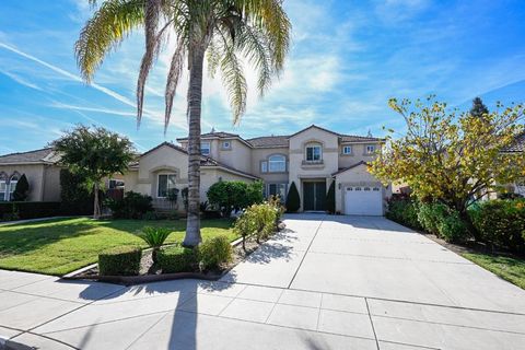 Situated in a peaceful neighborhood within the award-winning Clovis Unified School District, this home exudes a welcoming ambiance from the moment you step inside. The open layout, high ceilings, and abundant natural light create an inviting atmosphe...