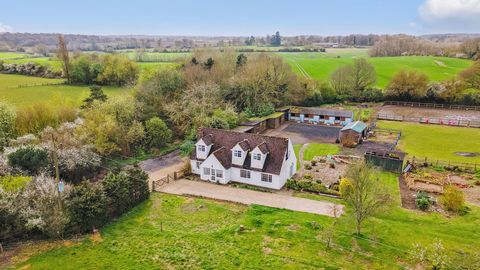 An equestrian four bedroom detached family residence privately secluded amidst 11.2 acres of picturesque paddocks, set in the tranquil countryside to the outskirts of the idyllic Hertfordshire village of Flamstead. Nestled along a secluded bridle pat...