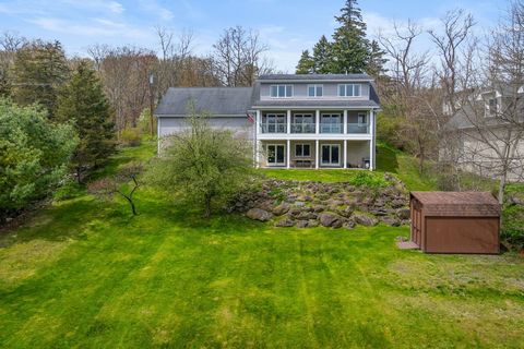 Welcome to 163 Patterson, a must see Hudson River front cape cod, nestled on a dead end street in Saugerties, NY. Upon entering the home you're greeted by the grand staircase and open concept kitchen, living and dining area. The kitchen exudes a naut...