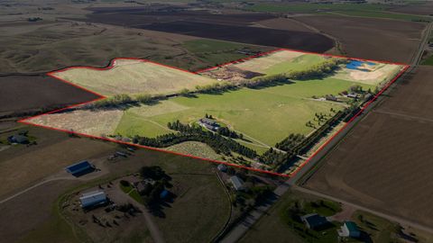 Located in Scottsbluff, Nebraska, Scottsbluff Equestrian Estate consists of 95.48 +/- acres composed of a beautiful custom home, productive irrigated hay fields, a wooded creek that runs throughout the property, and a well maintained pond that is hom...