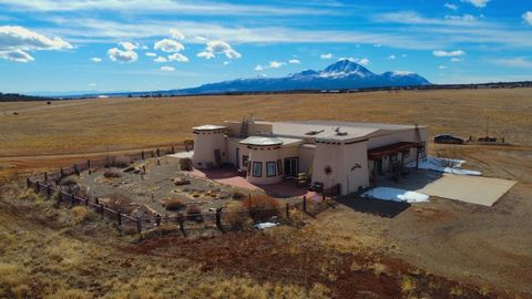 Discover your dream home in a serene location with breathtaking views and abundant space. Situated northwest of Cortez, this single-level gem is a rare offering in the prestigious Indian Camp Ranch subdivision, renowned as the first archeological sub...