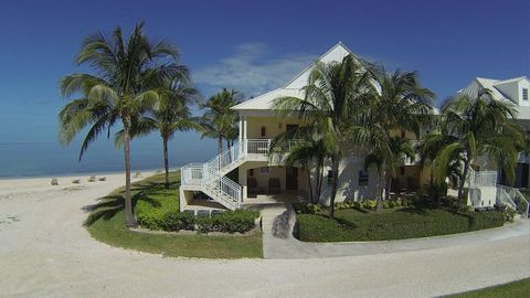 In the prestigious and exclusive gated community of Old Bahama Bay in Grand Bahama Island's West End, this unique condo/hotel residence, with yacht dockage right outside your door, combines all the amenities of a serene sophisticated upscale tropical...